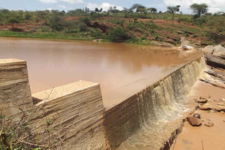 working sand dam with flowing water