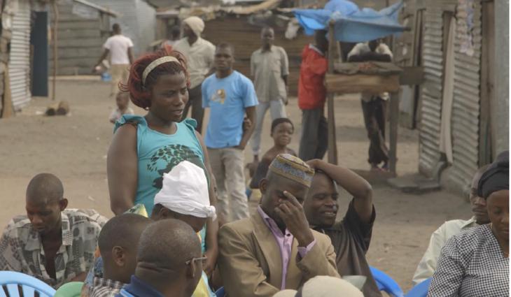 woman speaking in community discussion in Kachanga Uganda