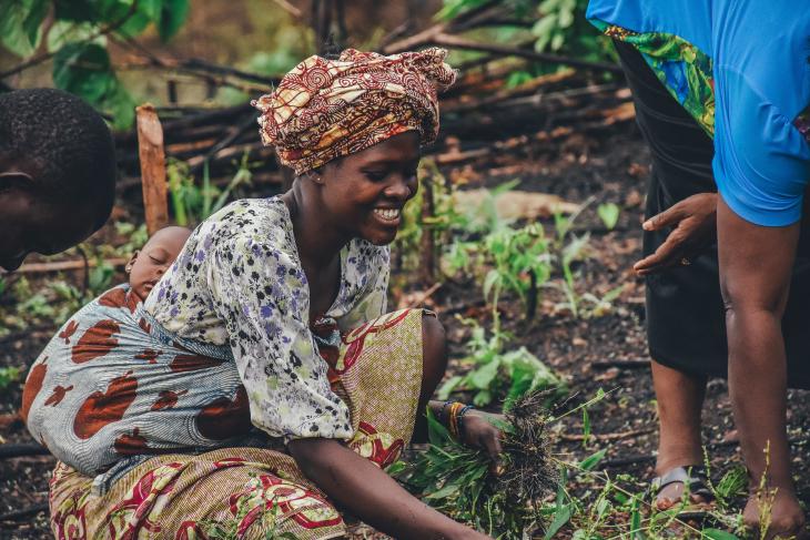 woman farmer examining crops