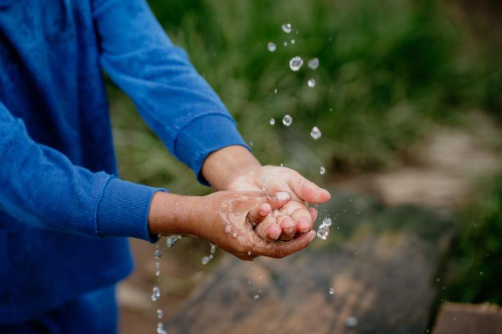 hands washed in dripping water