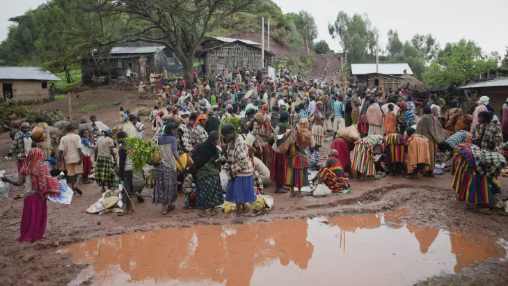 village gathering in flooded area